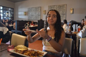 Shea Aquilino is taking a picture of a French dish called Croque Monsieur